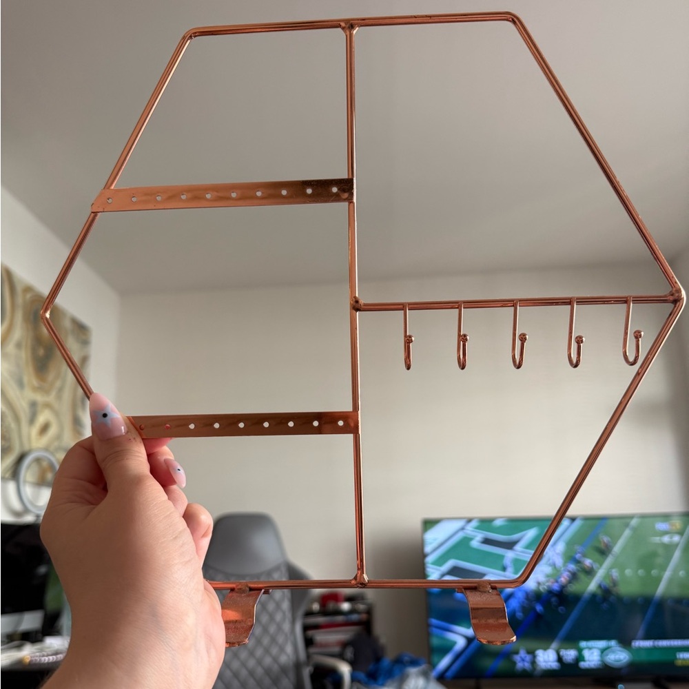 Rose gold jewelry holder with earring holes